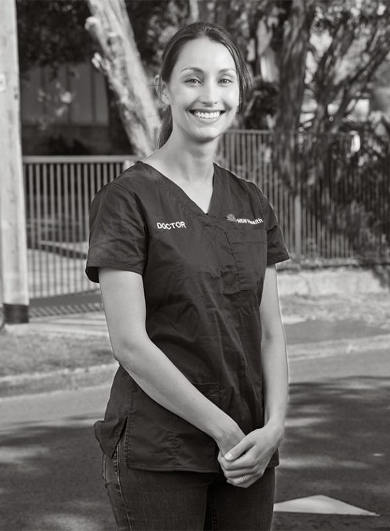 Black and white portrait of Shree outside her home in Gladesville for Fine Photography's COVID vaccination campaign 'Our Call to Arms'.